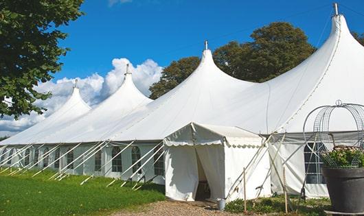 a line of sleek and modern portable restrooms ready for use at an upscale corporate event in Bloomingdale, NJ